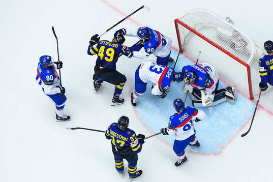 Fabian Zetterlund of Sweden fights with Andrej Golian of