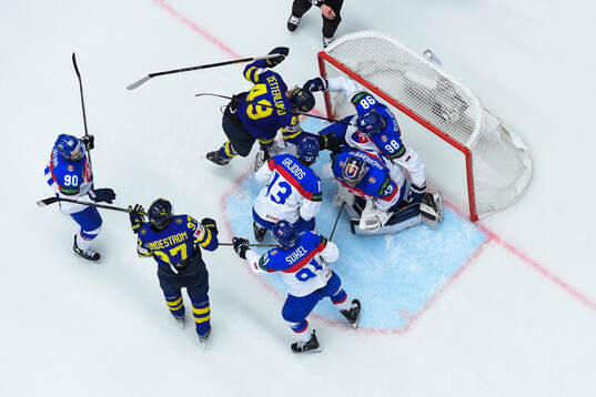 Fabian Zetterlund of Sweden fights with Andrej Golian of