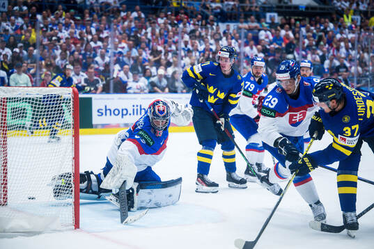 Isac Lundeström of Sweden scores 4-0 behind goaltender