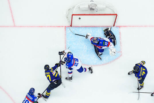 Isac Lundeström of Sweden scores 4-0 behind goaltender