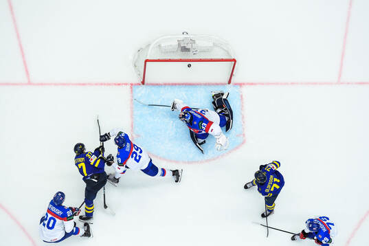 Isac Lundeström of Sweden scores 4-0 behind goaltender