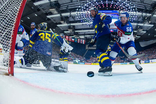 Goaltender Filip Gustavsson, Tim Heed of Sweden against