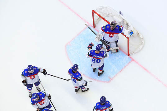 Goaltender Stanislav Skorvanek of Slovakia with temmates