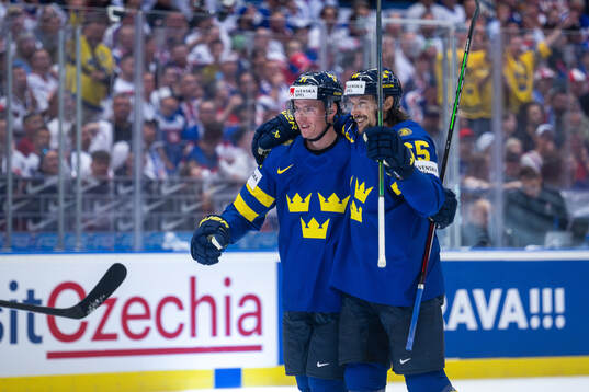Victor Olofsson and Erik Karlsson of Sweden celebrate the