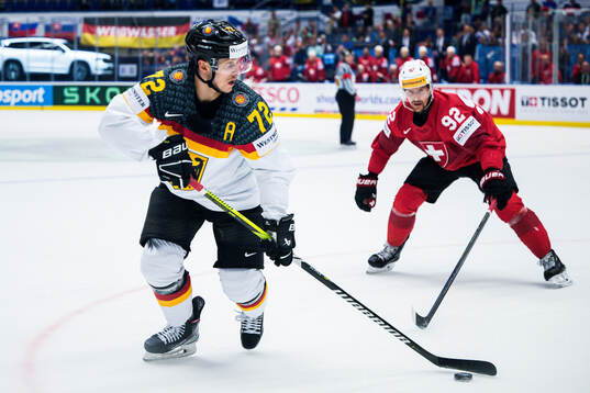 Dominik Kahun of Germany and Gaetan Haas of Switzerland