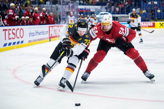 Dominik Kahun of Germany and Christian Marti of Switzerland