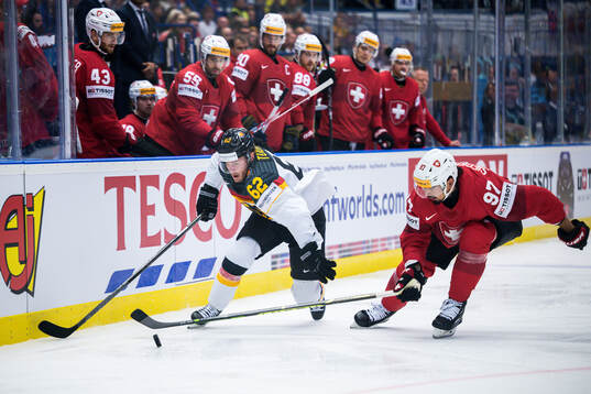 Parker Tuomie of Germany and Jonas Siegenthaler of