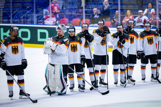goaltender Philipp Grubauer of Germany look dejected with
