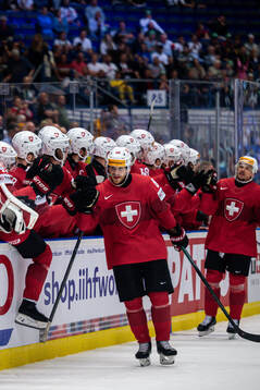 Christoph Bertschy of Switzerland celebrates the 3-1 goal