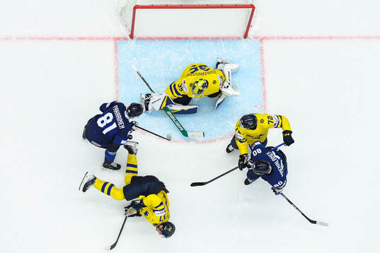 Tim Heed, Isac Lundeström and goaltender Filip Gustavsson
