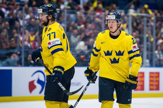 Victor Hedman and Rasmus Dahlin of Sweden looks dejected