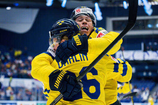 Rasmus Dahlin and Lucas Raymond of Sweden celebrates