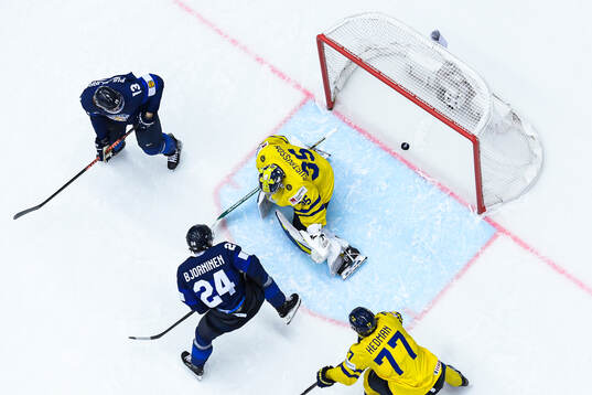 Hannes Björninen of Finland (not in frame) scores 1-1