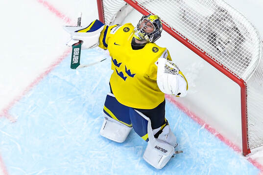 Goaltender Filip Gustavsson of Sweden celebrates