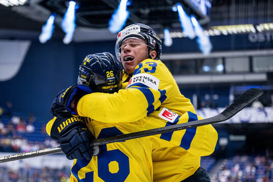 Lucas Raymond and Rasmus Dahlin of Sweden celebrate the 1-0