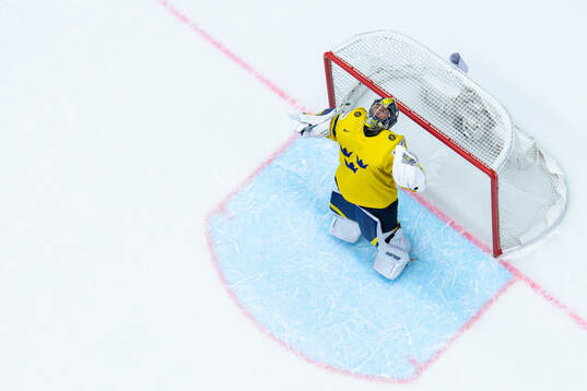 Goaltender Filip Gustavsson of Sweden celebrates the win