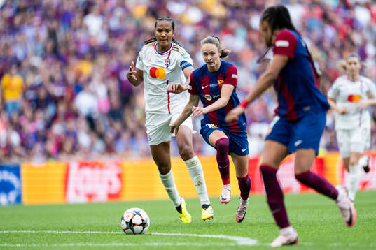 Wendie Renard of Lyon and Caroline Graham Hansen of