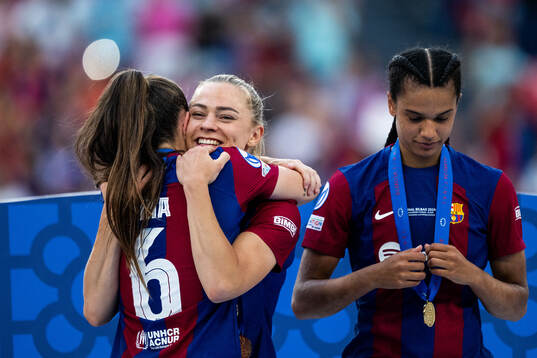 Fridolina Rolfö and Claudia Pina of Barcelona celebrate