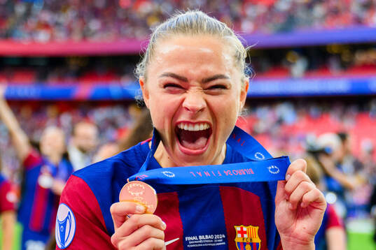 Fridolina Rolfö of Barcelona celebrates with her gold medal