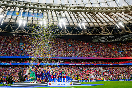 Players of Barcelona celebrates with the trophy