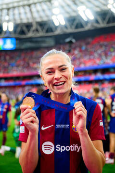 Fridolina Rolfö of Barcelona celebrates with her gold medal