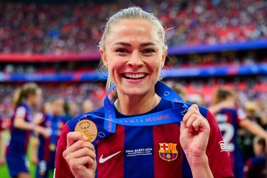 Fridolina Rolfö of Barcelona celebrates with her gold medal