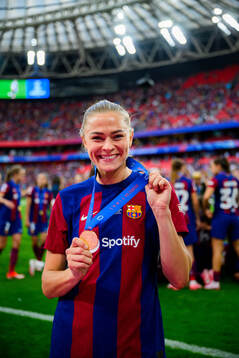 Fridolina Rolfö of Barcelona celebrates with her gold medal