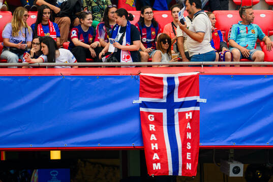 A flag with the last name of Caroline Graham Hansen
