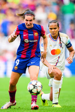 Mariona Caldentey of Barcelona and Wendie Renard of Lyon