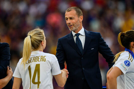 UEFA president Aleksander Ceferin and Ada Hegerberg of Lyon
