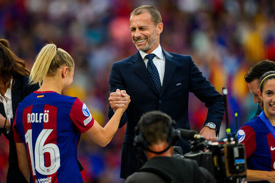 UEFA president Aleksander Ceferin hands Fridolina Rolfö of