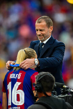UEFA president Aleksander Ceferin hands Fridolina Rolfö of