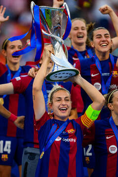 Alexia Putellas of Barcelona lifts the trophy