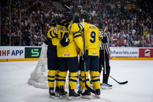 Marcus Pettersson of Sweden celebrates with team mates