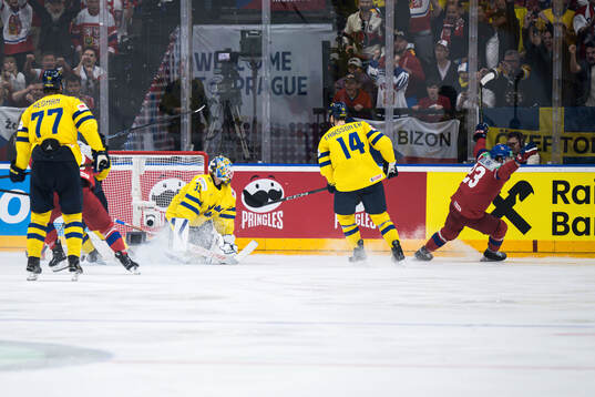 Goaltender Samuel Ersson of Sweden looks dejected