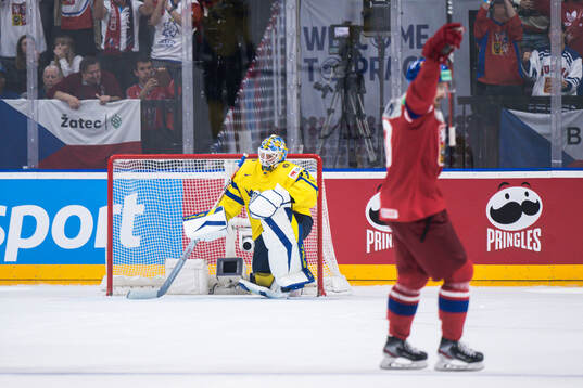Goaltender Samuel Ersson of Sweden looks dejected