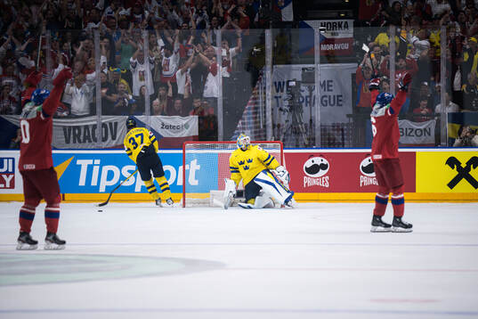 Goaltender Samuel Ersson of Sweden looks dejected