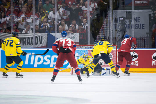 Lukas Sedlak of Czech Republic scores 7-3 behind goaltender