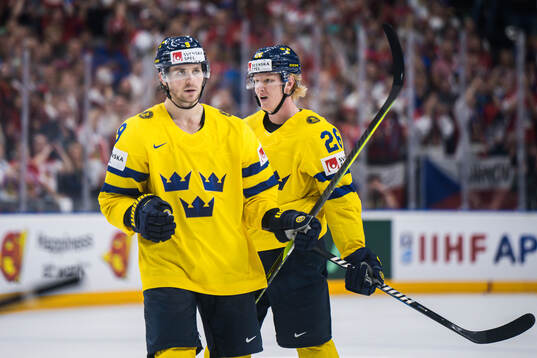 Adrian Kempe and Rasmus Dahlin of Sweden look dejected