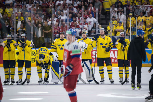 Victor Hedman and Erik Karlsson of Sweden look dejected