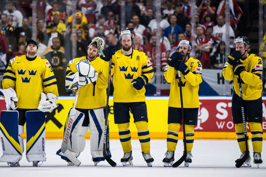 Victor Hedman and Erik Karlsson of Sweden look dejected