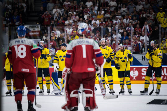 Victor Hedman and Erik Karlsson of Sweden look dejected