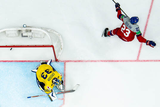 Goaltender Samuel Ersson Sweden looks dejected while Lukas