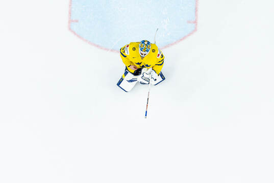 Goaltender Samuel Ersson of Sweden looks dejected