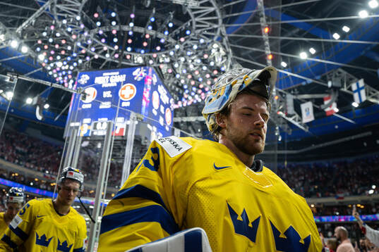 Goaltender Samuel Ersson of Sweden looks dejected