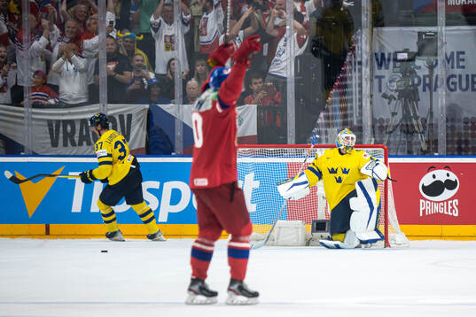 Goaltender Samuel Ersson of Sweden looks dejected