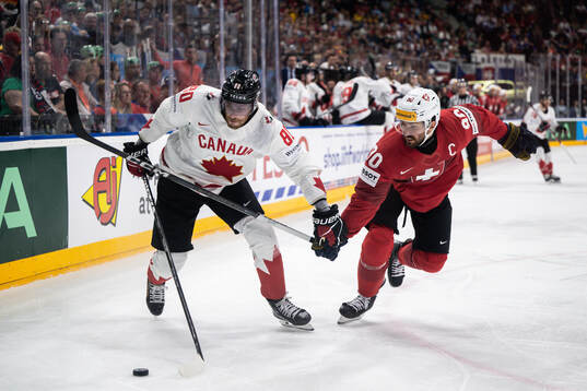 Pierre-Luc Dubois of Canada and Roman Josi of Switzerland