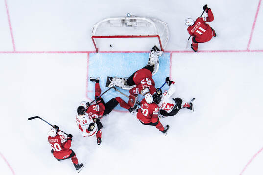 Brandon Tanev of Canada scores the 1-2 goal behind