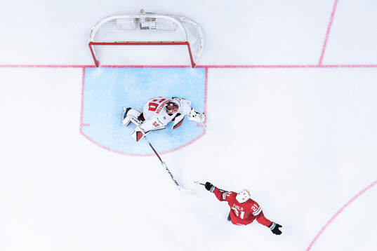 Kevin Fiala of Switzerland scores a goal behind goaltender