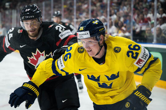 Jamie Oleksiak of Canada and Rasmus Dahlin of Sweden